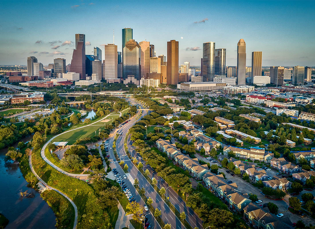 Contact - An Aerial View of the Skyline in Houston, Texas at Sunset
